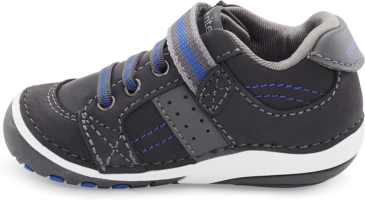 Black and blue children's sneaker with white sole and velcro strap