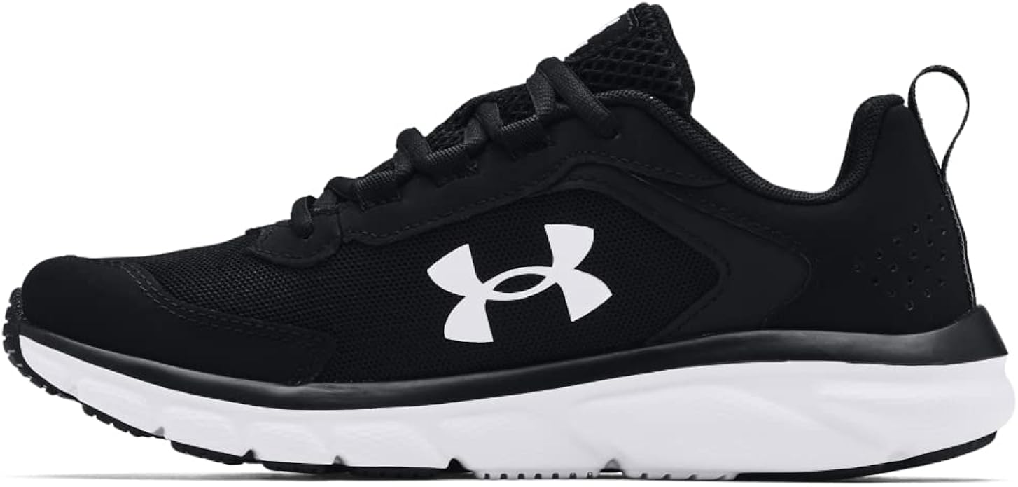 Black and white Under Armour running shoe with cushioned sole for kids