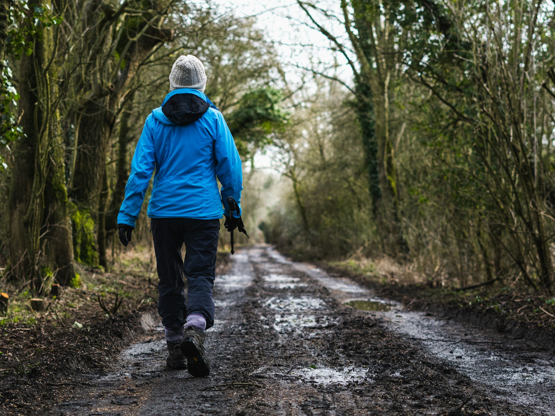 person walking on a trail
