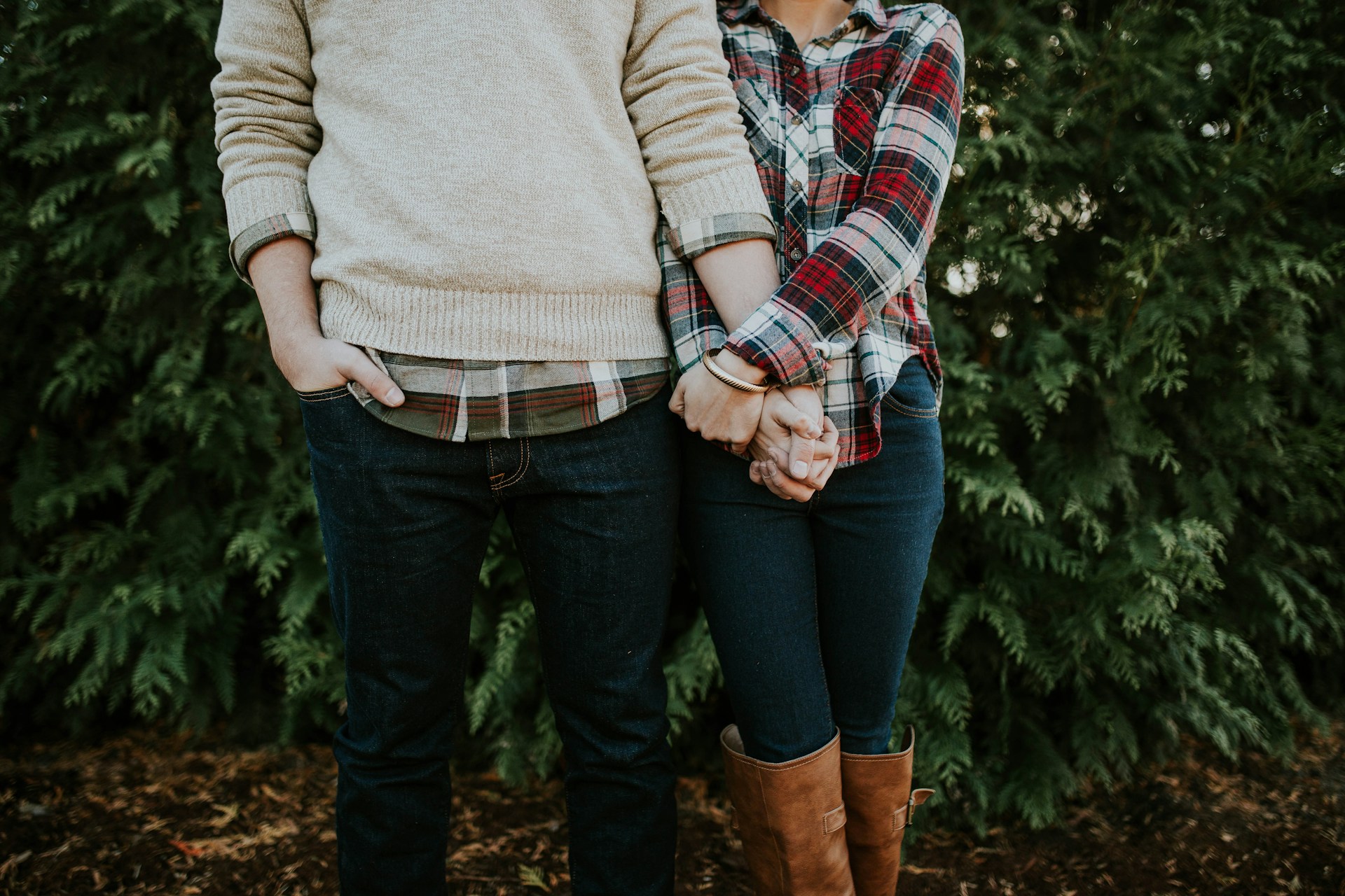 man and woman holding hands / zodiac signs