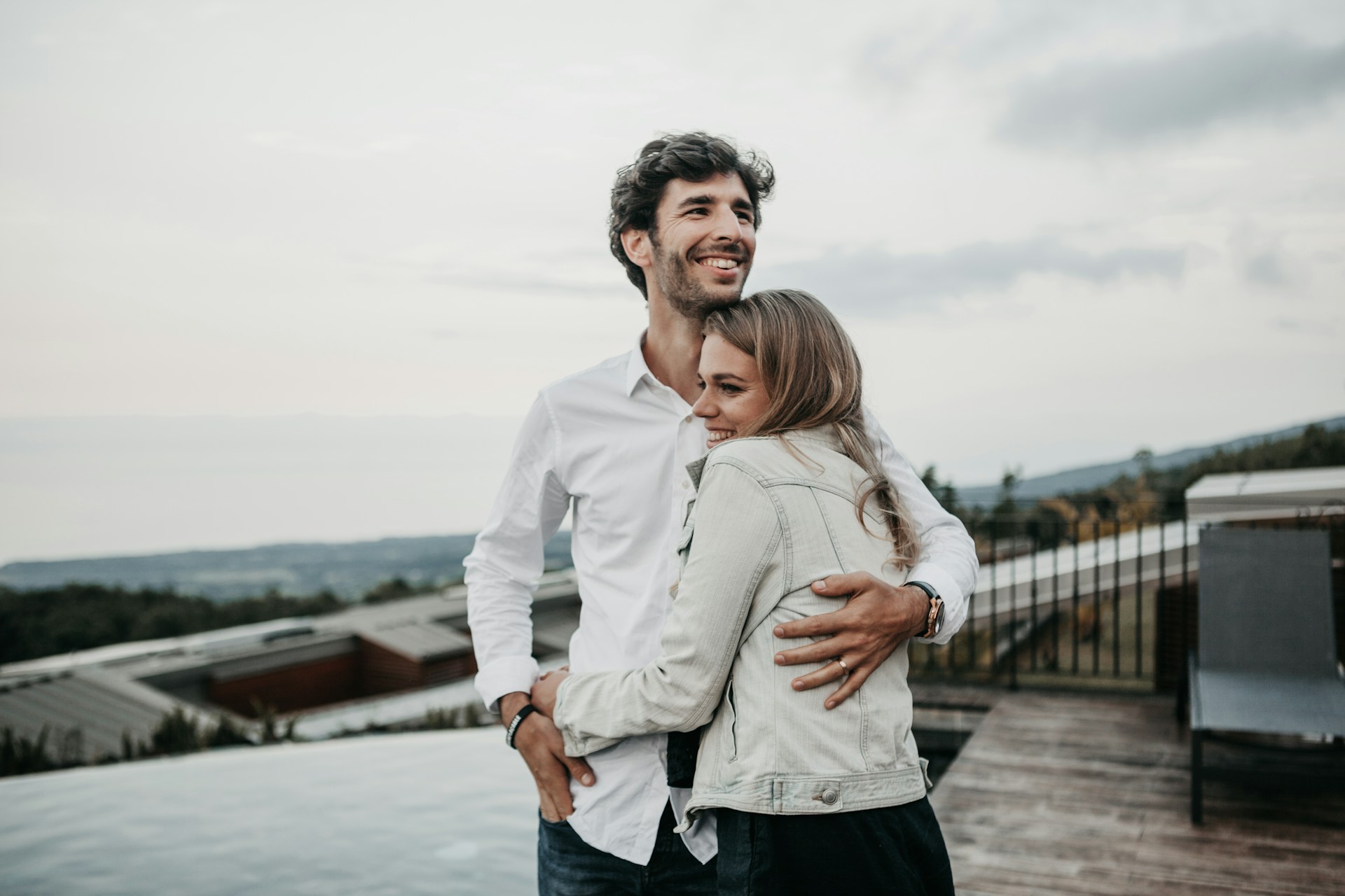 man and woman hugging