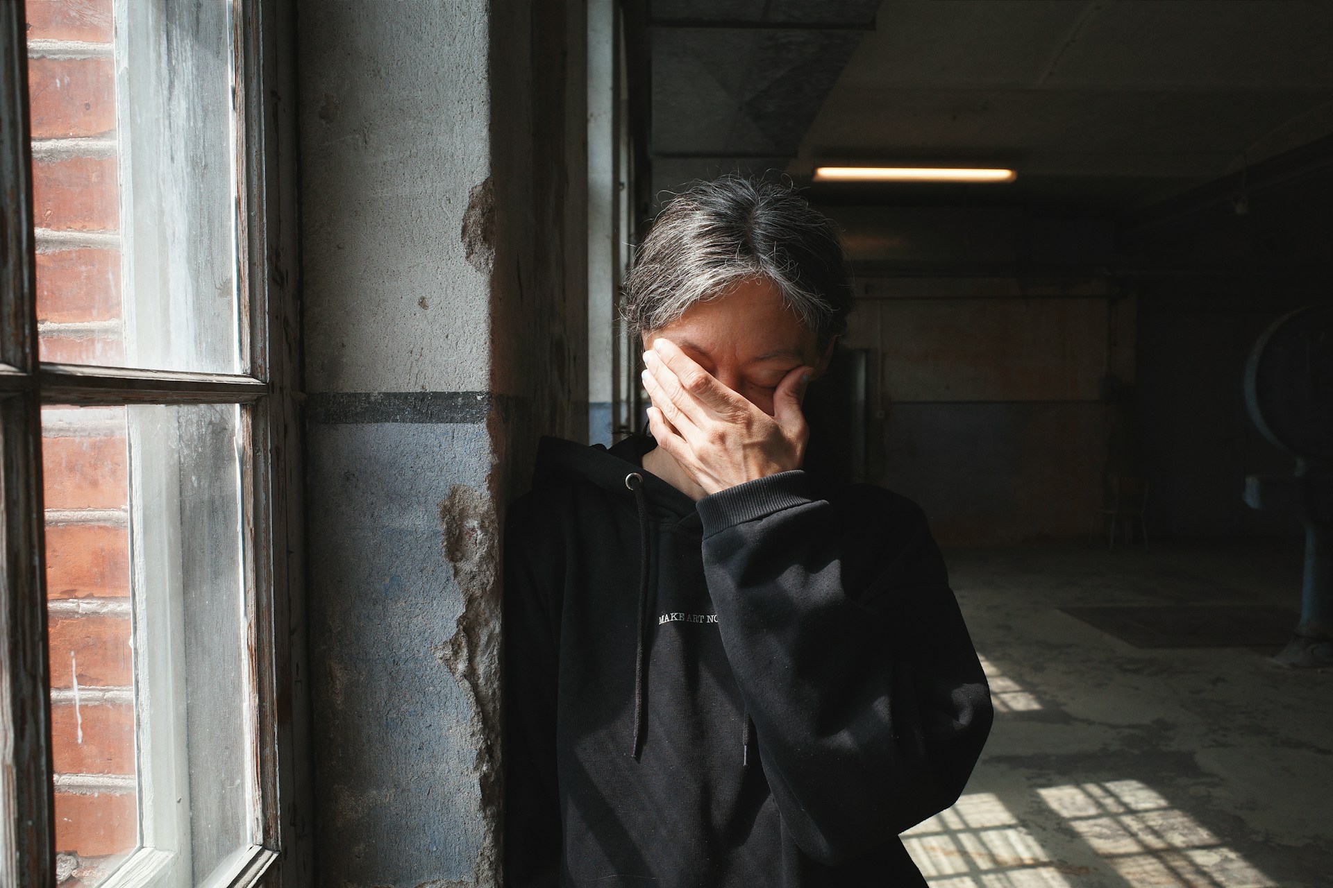 woman with hand over face
