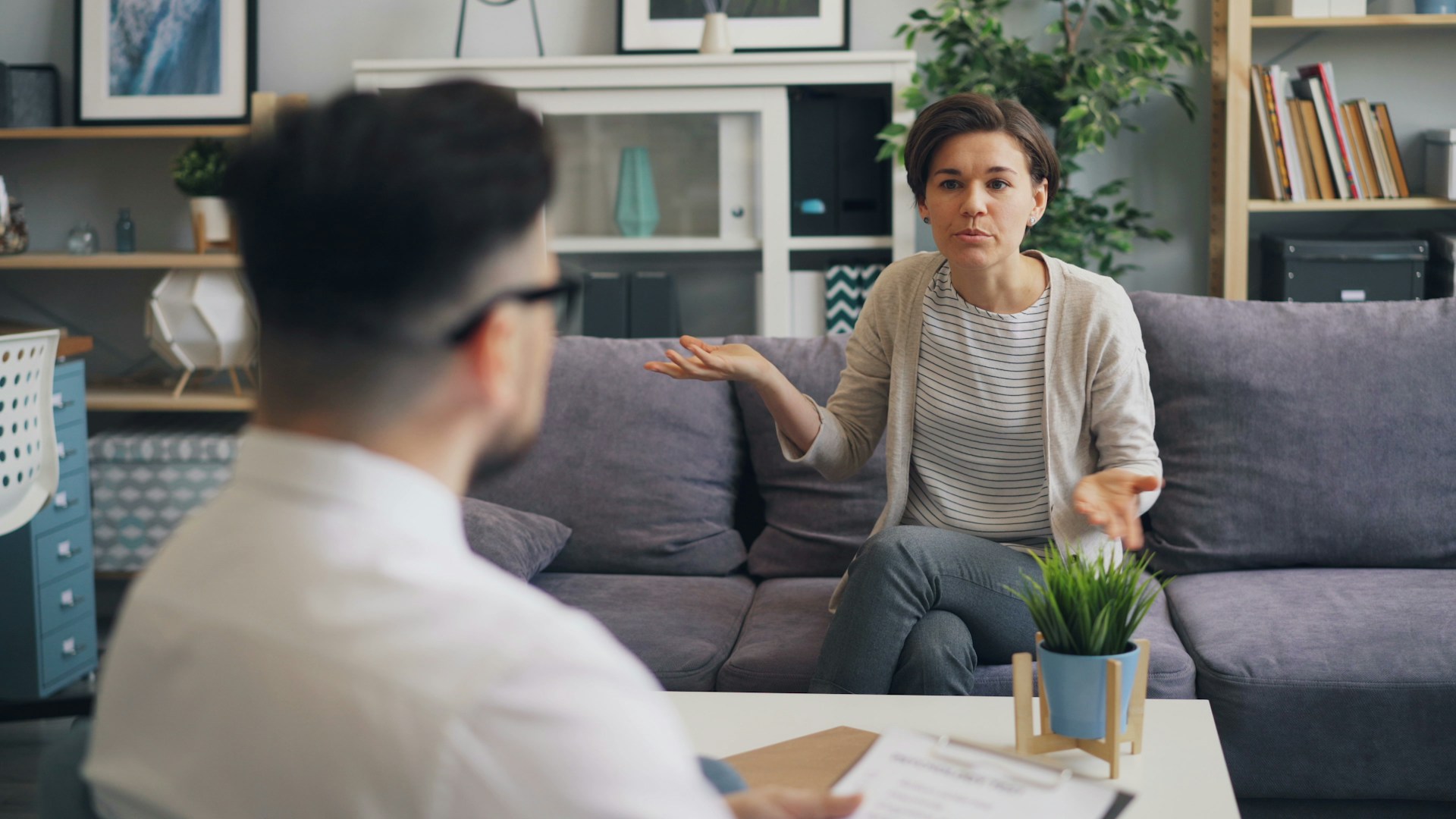 woman with hands held out to man