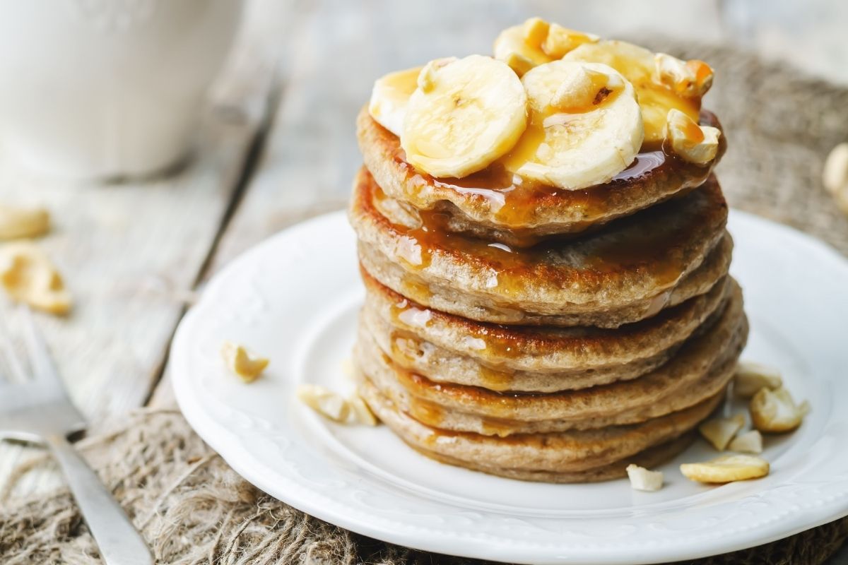 Banana pancakes with bananas, cashews, and salted caramel sauce