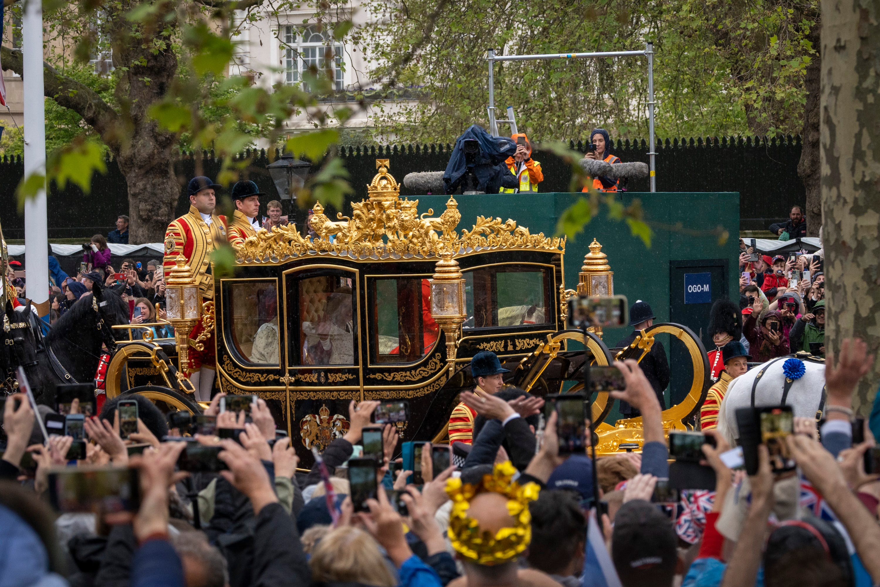 London, England; King Charles III and Queen Camilla process along The Mall in the Diamond Jubilee State Coach on the morning of