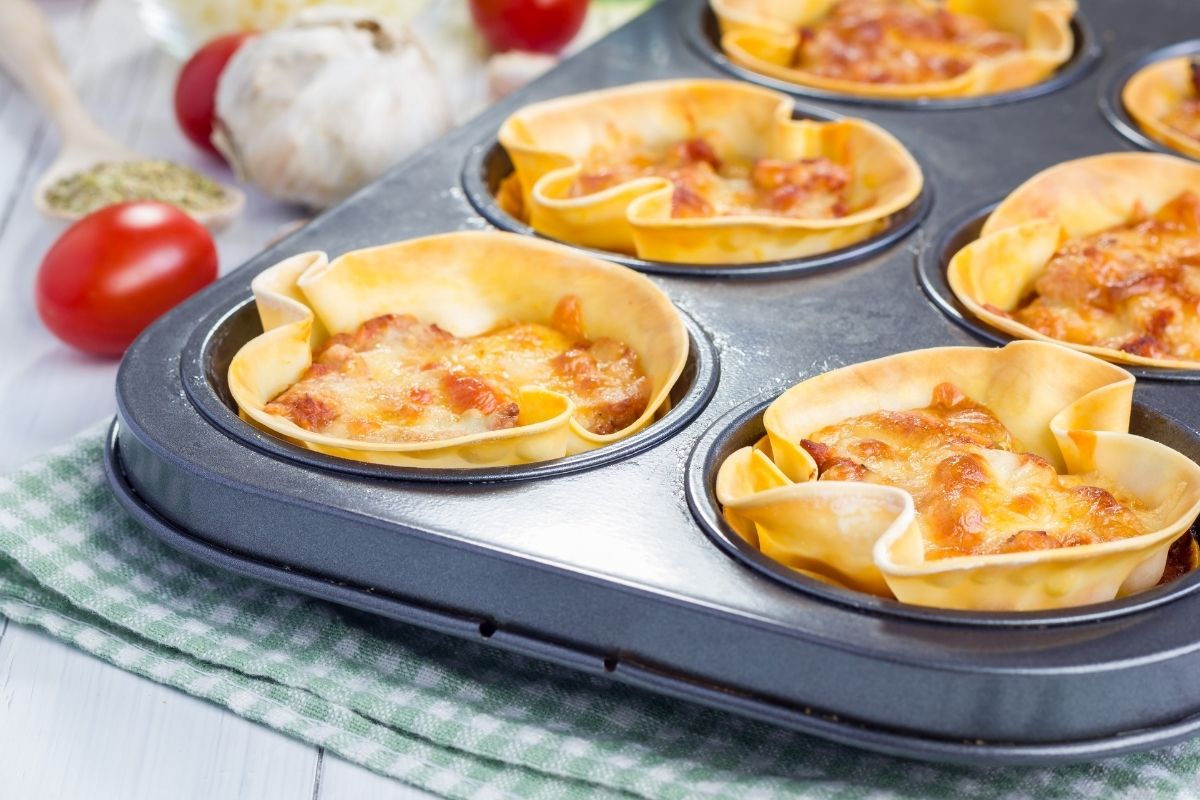 Lasagna cups in a baking tray.