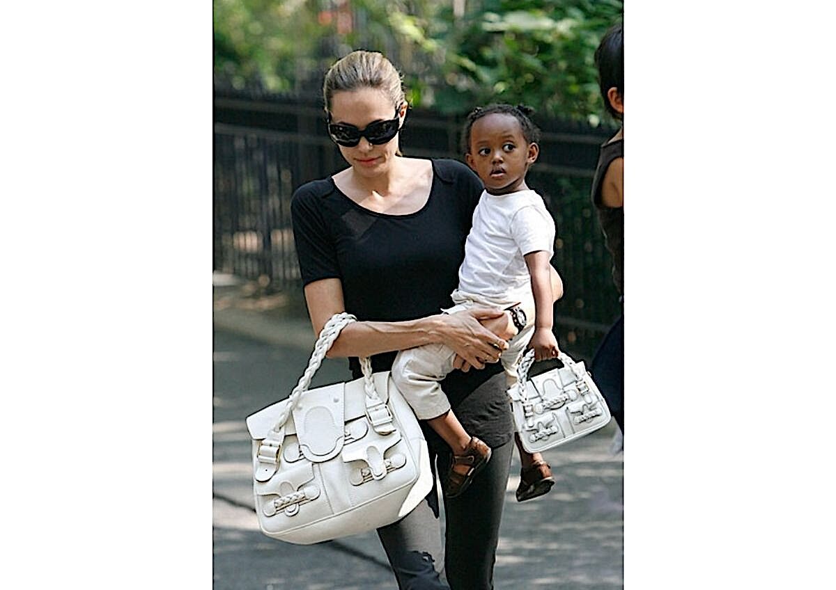 Angelina Jolie carrying her child, Zahara Jolie