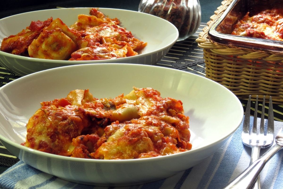 Baked ravioli casserole served in bowls.