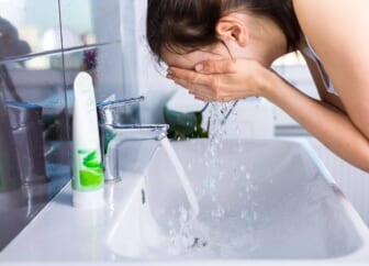 woman washing face