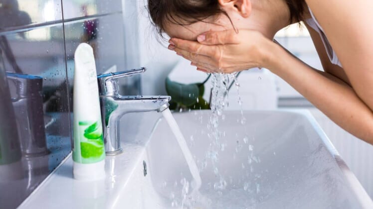 woman washing face