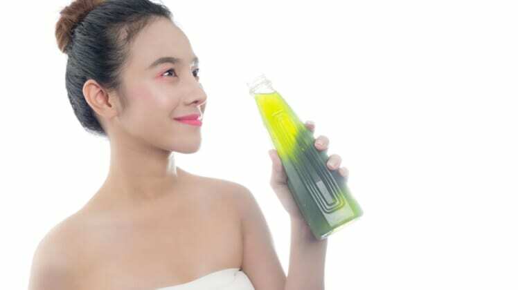 woman drinking Chlorophyll water