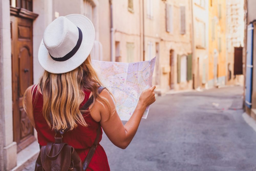 travel to Europe, tourist looking at map on the street, summer holidays turning 30, advice for 30 year old woman