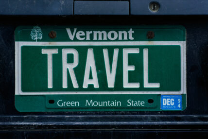Vermont license plate reading "TRAVEL" with Green Mountain State slogan