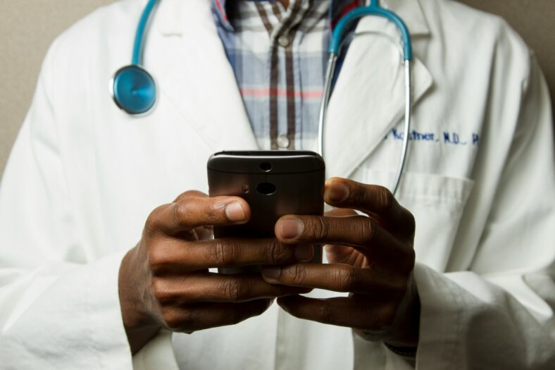 doctor holding phone