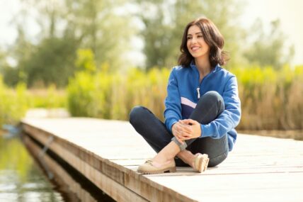 woman with quarter zip and capris / spring clothing at costco