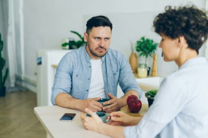 unhappy guy staring at woman / zodiac signs