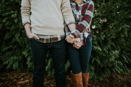 man and woman holding hands / zodiac signs