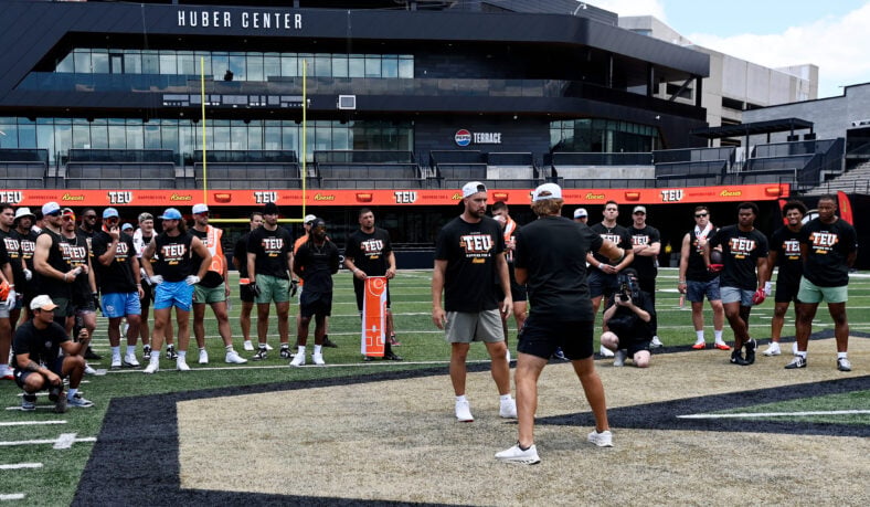 Kansas City Chiefs tight end Travis Kelce and former NFL player Greg Olsen demonstrate a drill during the Tight End University