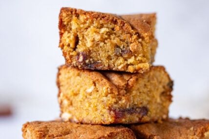 A pile of stacked slices of brown sugar cashew blondies.