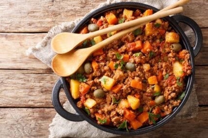 Picadillo cooked from ground beef with vegetables, raisins and spices