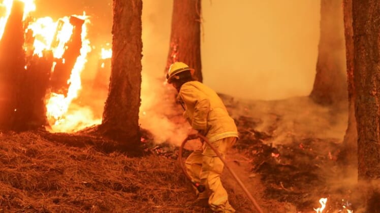 Crews battling California's mammoth Dixie fire brace for high winds 1
