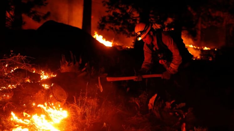 Residents, tourists scramble to evacuate as California fire nears Lake Tahoe